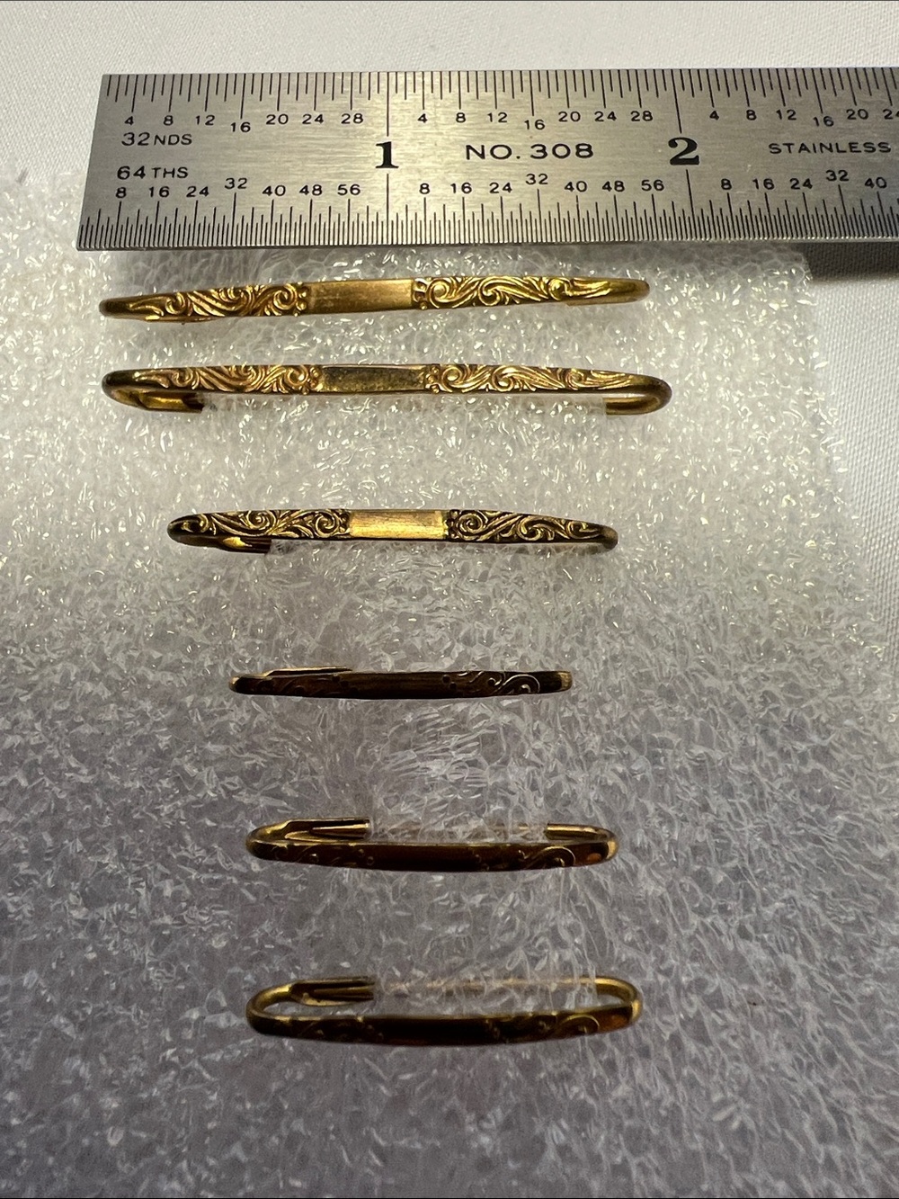 Victorian / Eduardian Era  Kilt Pin, graduated set of 6, gold tone, floral etchi